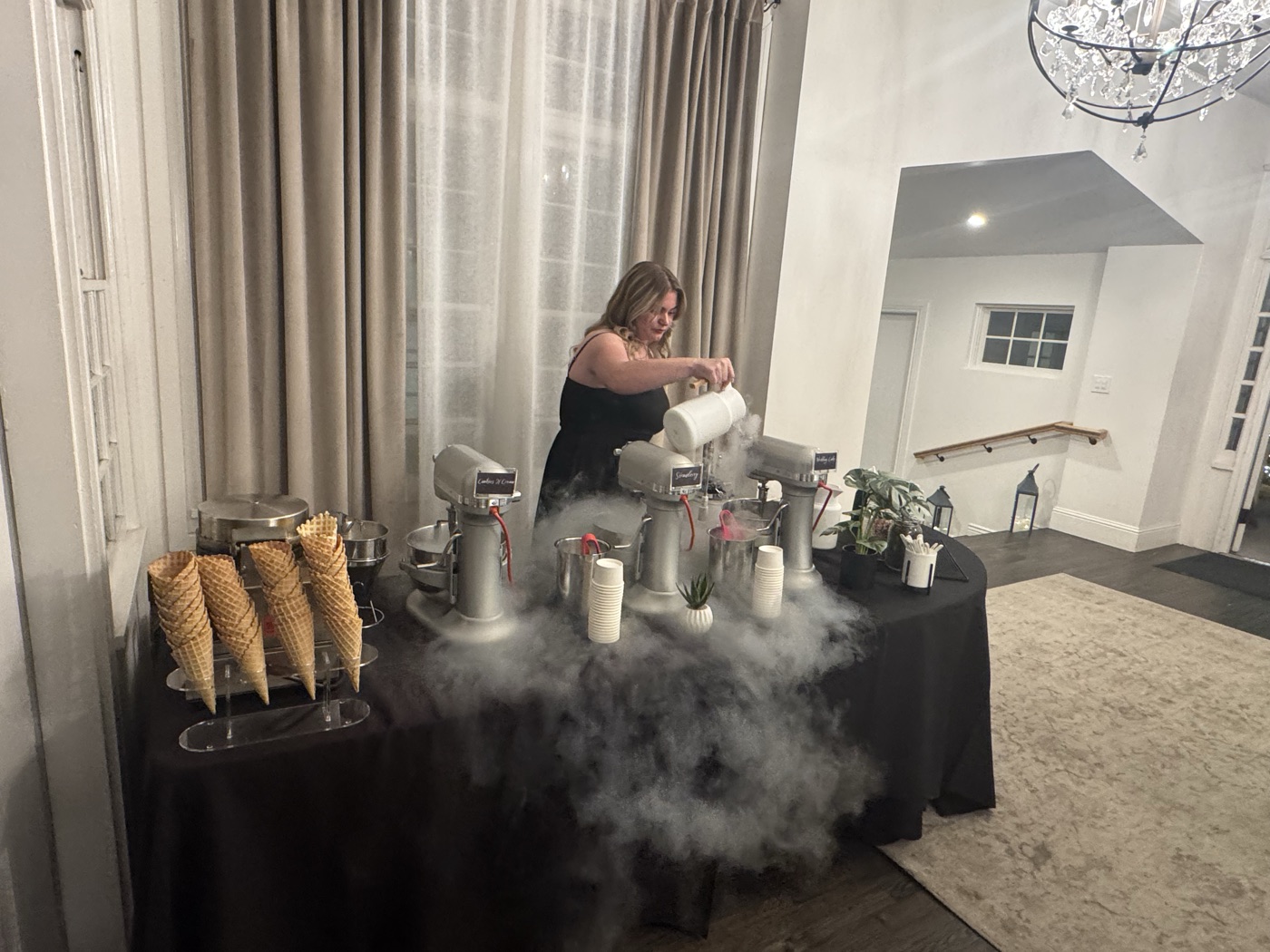 The Polar Bros nitro cart at an indoor venue with liquid nitrogen fog rolling over the waffle cones