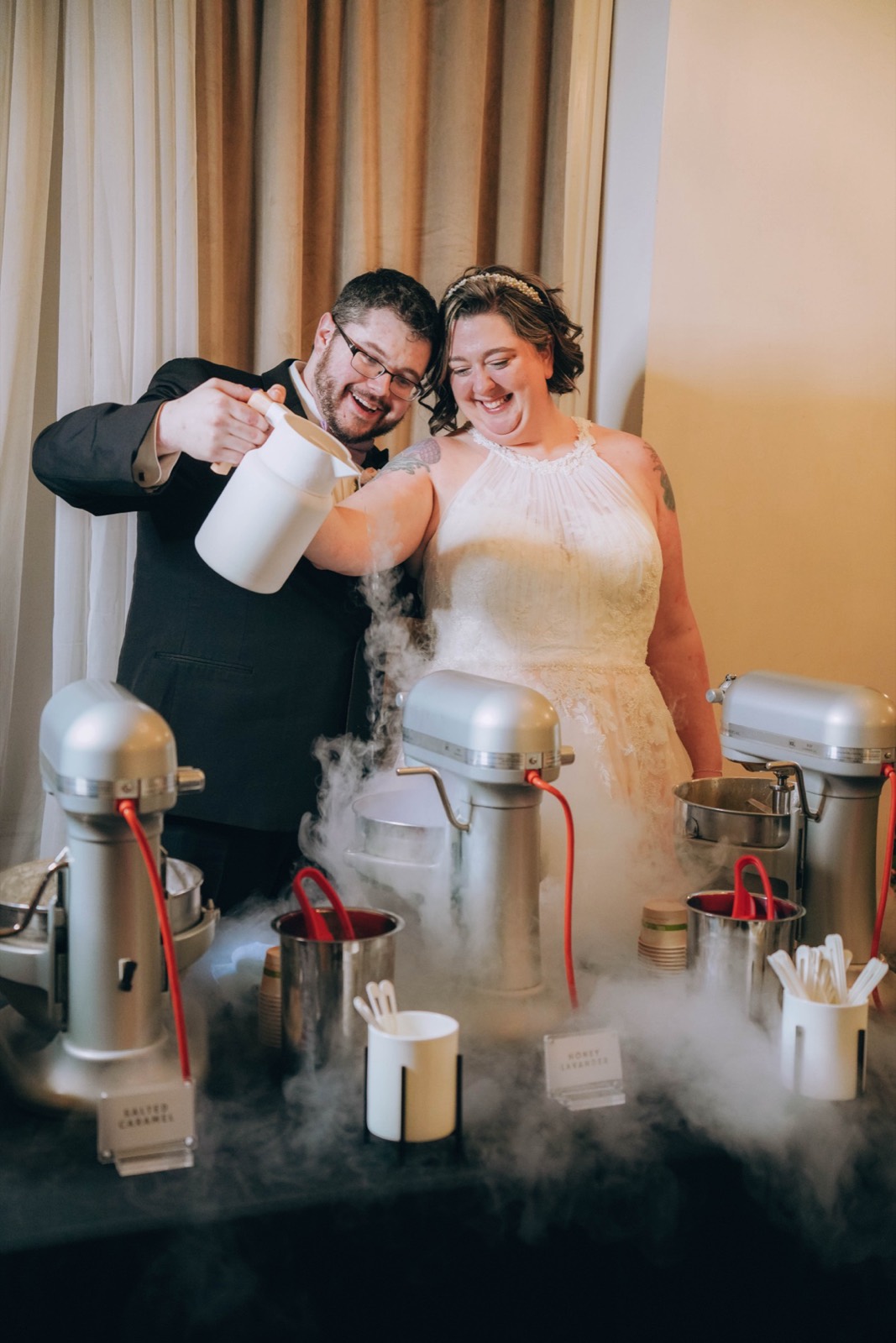 Liquid nitrogen poured into stand mixers, fog billowing over the flavor labels